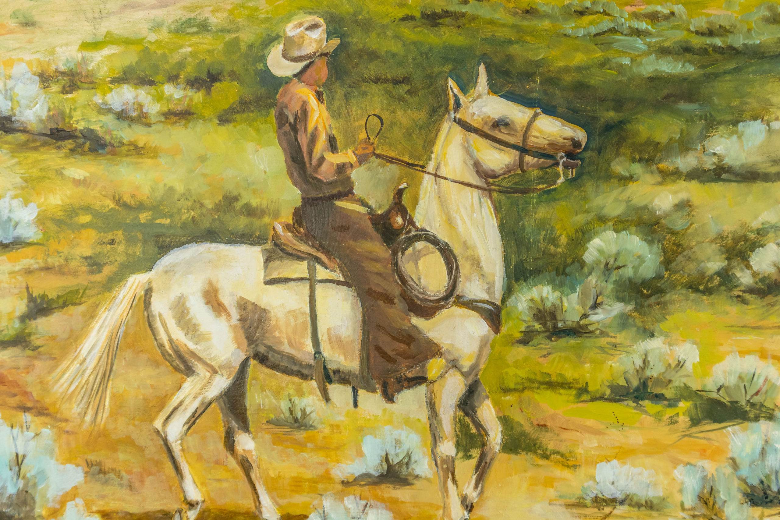 COWBOY ON HORSE WITH CATTLE